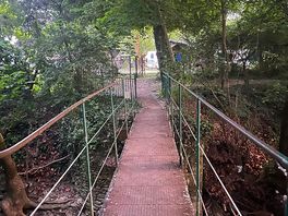 A small footbridge from site to riverside.