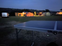 Camp at night with facilities
