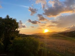 Uitzicht zonsondergang vanaf terras