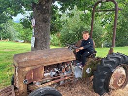 Sitting on the old tractor