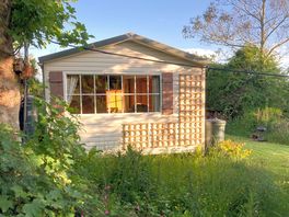 Rose chalet in the evening sunlight