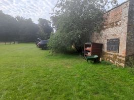Walled garden with the car park and provisions shack.