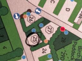 Bell tents sandwiched by roads opposite main entrance