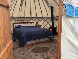 Inside yurt with log fire