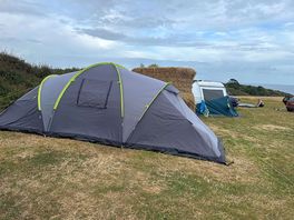 A photo of our tent that we didn’t put up correctly for good measure, lol!