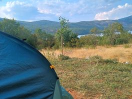 Tent pitch with a mountain view