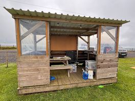 But with picnic table, surface for your cooker and bins,