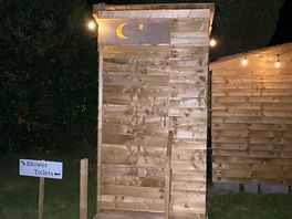 The compost toilets at night.