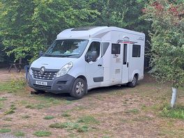 Our van under the trees.