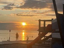 Sun over beach