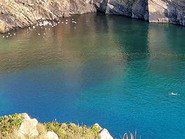 A wave from a solitary swimmer, solva.