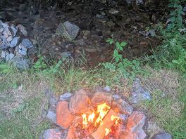 Campfire next to the river