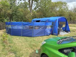 Pitch with tent and windbreakers