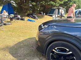 Our car our tent was behind and the neighbors setting up, very small pitches