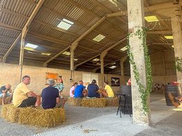 The inside of the barn where live music was played all night & tin van in the corner serving drinks
