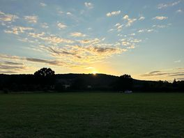 Sunset over back of field