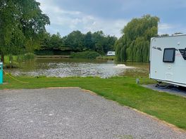 Level pitches with view of the lake