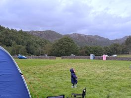 Tent and view of field and mountains from our pitch