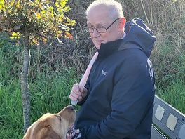 Hubby and our dog sitting watch the view