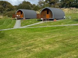 Two rental pods with parking