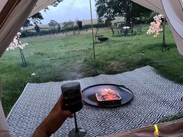 Sound of the rain glass of wine and fire