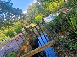 Lovely area - waterfall, river, swimming pool and basketball courts.