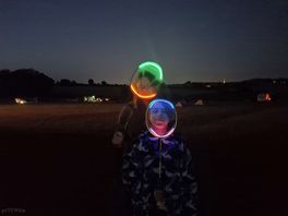 Children found a way to play babminton into the evening