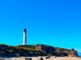 Beautiful scenery lighthouse next to site.