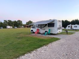 The camping field with the shower block in the distance