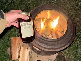 Making good use of the fire pit while having a good quiet drink