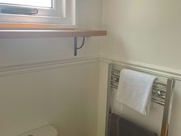 Bathroom was so clean with heated towel rail. soft white towels to use