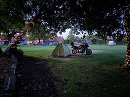 Tent next to motorcycle