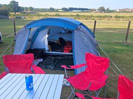 At the field camping