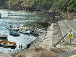 A small village up the hill of the campsite where they go canoeing, boating.