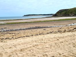 Beach to right after golf course path.