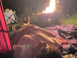 Late evening fire in the fire pit by the tent.