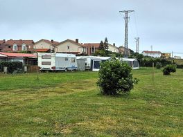 Camping field with old caravans on site