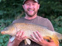 Happiest i've ever seen him! he caught this at the lake