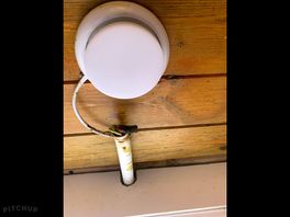 On ceiling in shower.