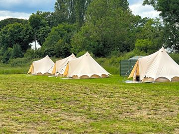 Bell tents on their pitches