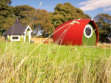 The Rowan Pod with the barbecue hut in the background