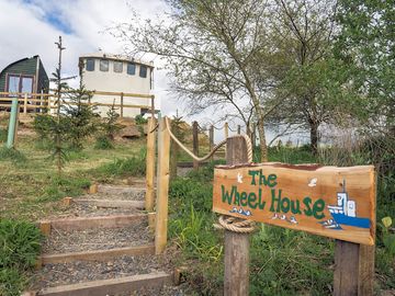 The wheel house is set on an incline, affording lovely views across the ponds