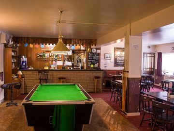 Play pool at the bar