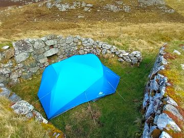 Sheltered tent pitch