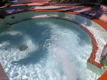 The 36°c swimming pool with a whirlpool