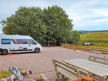 Visitor image of the area for parking up with table area to one side