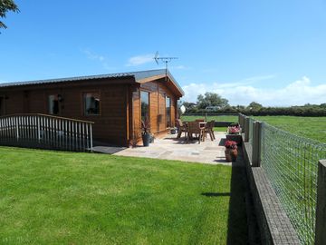 Patio and lawn round the lodge
