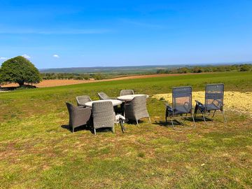 A small selection of patio furniture and sun loungers are available