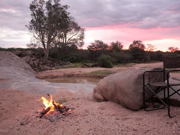 Campfire in a dry riverbed