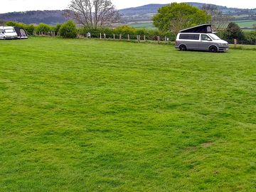 Open grass field campervans with our amazing views.